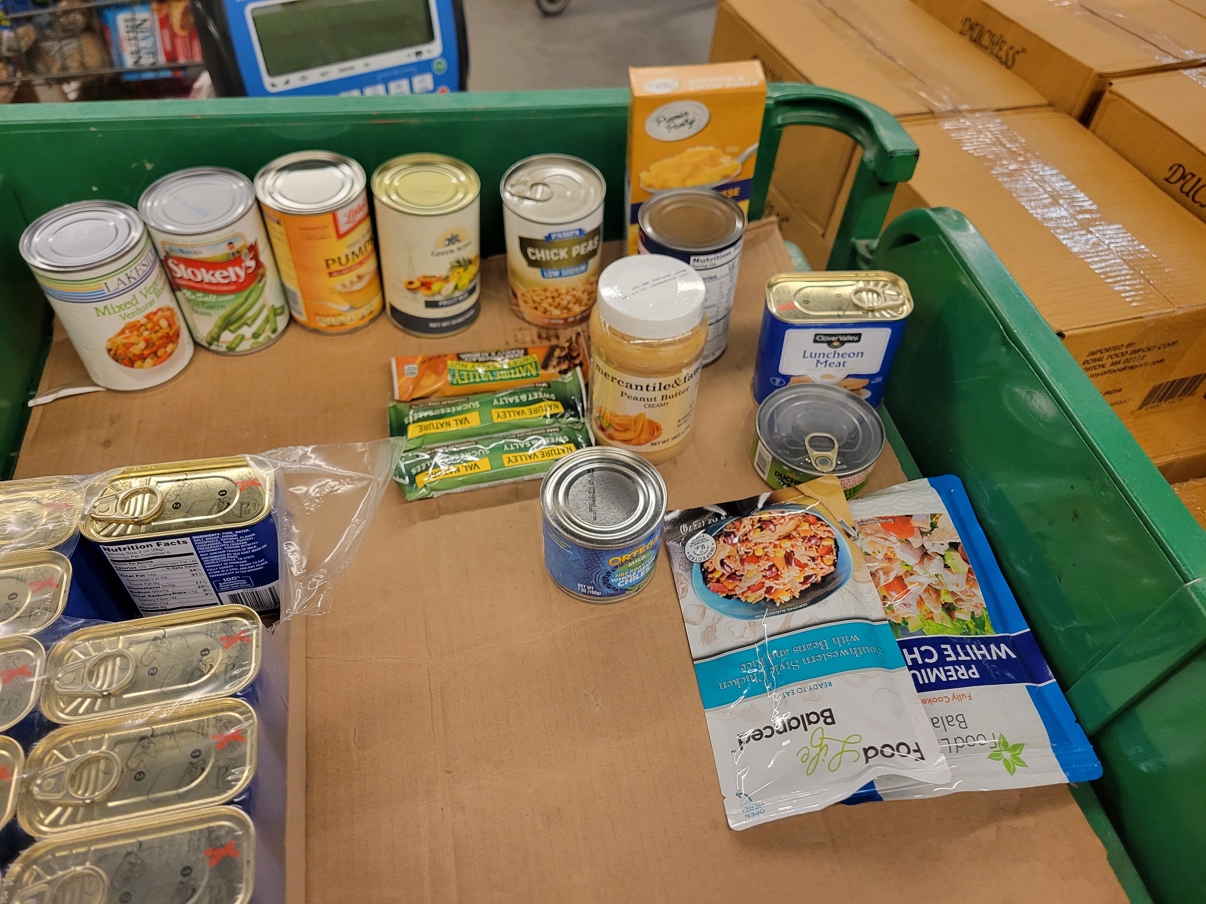 Open pack of V8 with plastic around it.